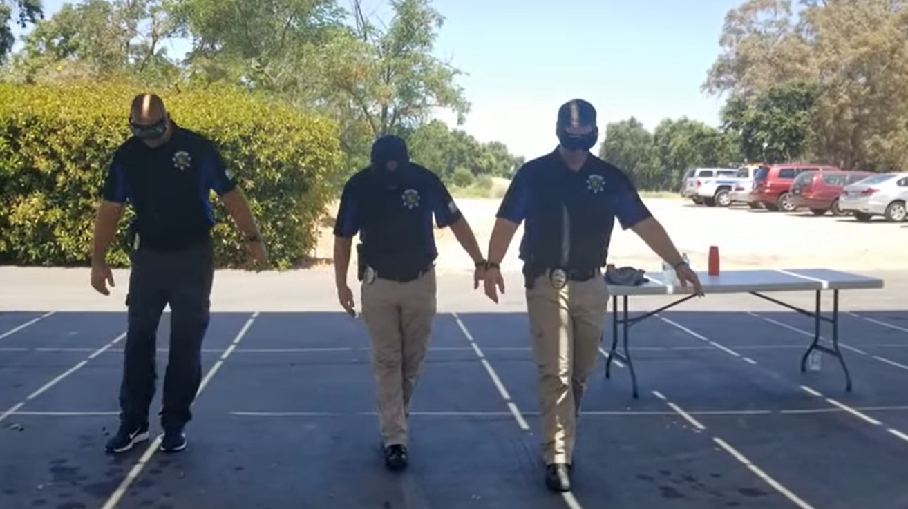 Rocklin, CA, police officers struggle to walk during a field sobriety test while testing 'alcohol impairment goggles.'