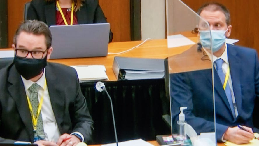 Minneapolis Defense Attorney Eric Nelson (left), and former Minneapolis Police Officer Derek Chauvin, listening to a witness during Chauvin's trial on April 5 in Minneapolis.