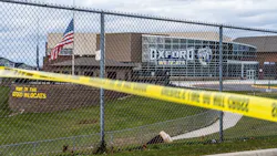 Flags wave at the rear entrance of Oxford, MI, High School on Dec. 2 after an active shooter situation Nov. 30 at the school that left four students dead and seven others with injuries. Flags wave at the rear entrance of Oxford, MI, High School on Dec. 2 after an active shooter situation Nov. 30 at the school that left four students dead and seven others with injuries.