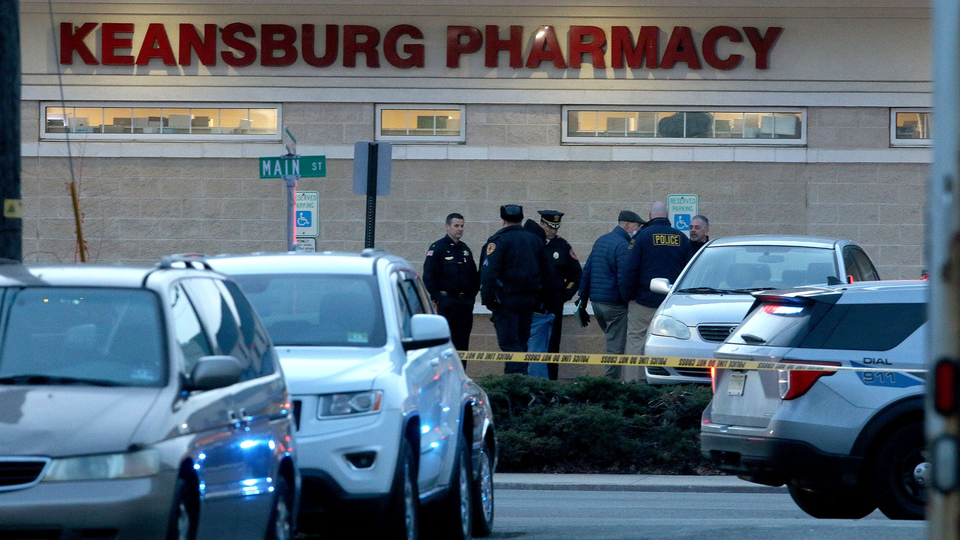 A robbery suspect was fatally shot by Keansburg, NJ, police after an officer was stabbed during the call at a pharmacy Thursday.