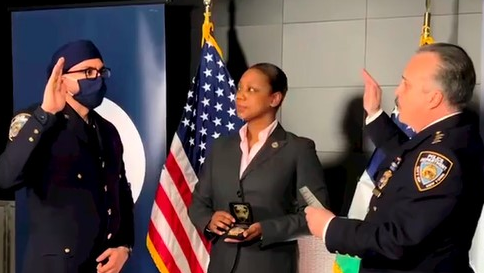 Sumit Sulan, who fatally shot the suspect responsible for killing two NYPD officers, was promoted to detective during a brief ceremony at police headquarters Tuesday.