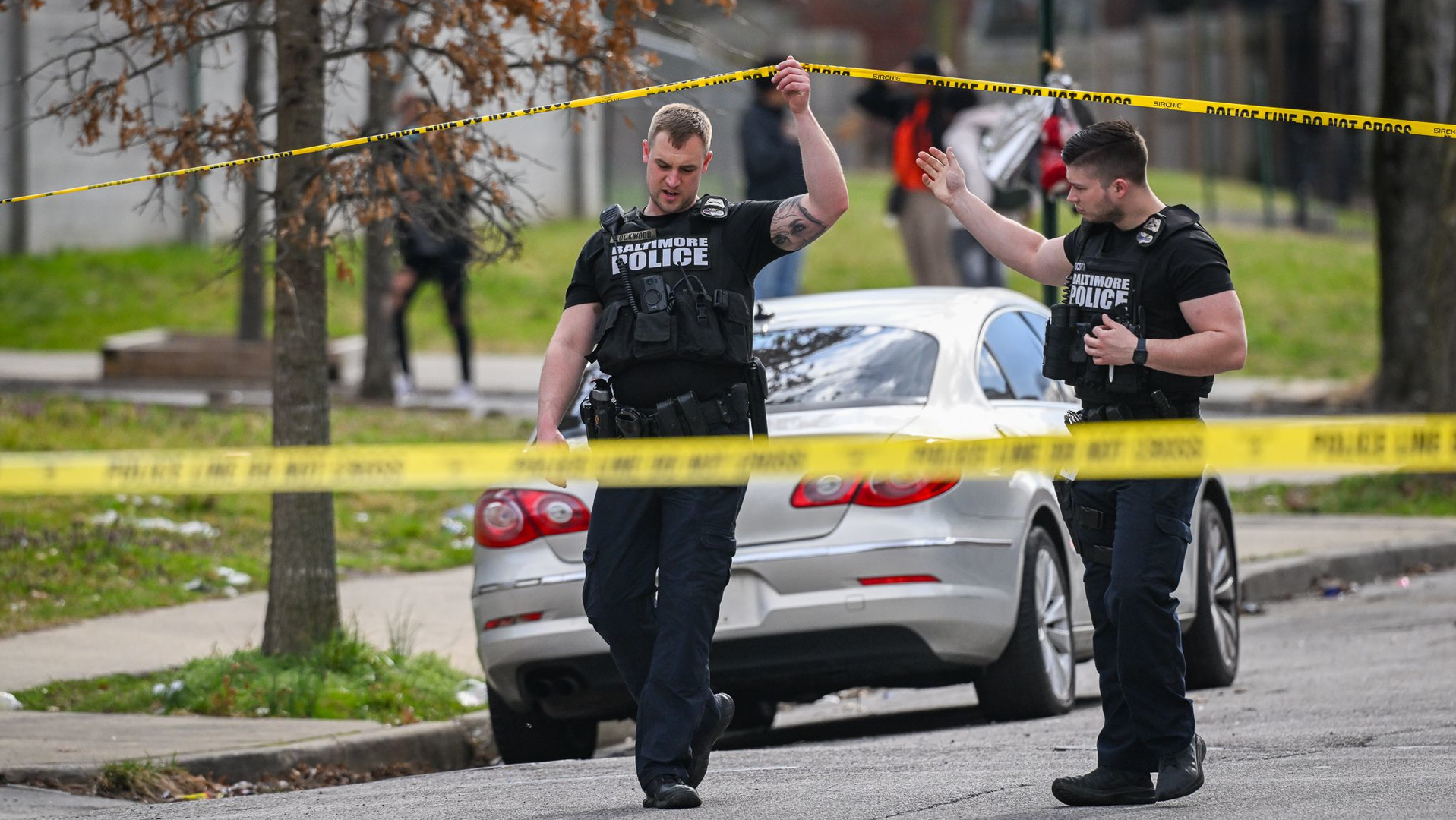 Baltimore police officers investigate a shooting scene near McCulloh and Wilson streets on Friday, March 18.