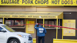 A man is accused of shooting and wounding two Chicago police officers at a hot dog stand Friday after his gun fell out of his waistband while he was in line. A man is accused of shooting and wounding two Chicago police officers at a hot dog stand Friday after his gun fell out of his waistband while he was in line.