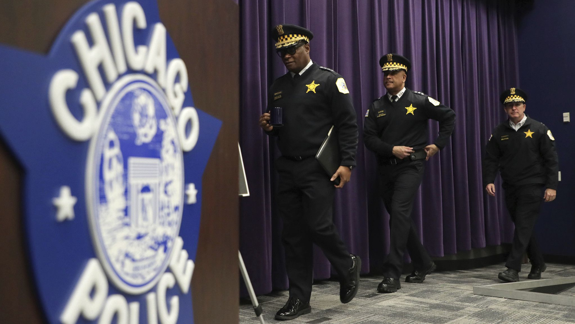Chicago Police Superintendent David Brown (from left), First Deputy Superintendent Eric Carter and Chief of Operations Brian McDermott arrive at a news conference at police headquarters March 22.