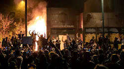 The Minneapolis Third Police Precinct is set on fire during a third night of protests following the death of George Floyd in May 2020. The Minneapolis Third Police Precinct is set on fire during a third night of protests following the death of George Floyd in May 2020.