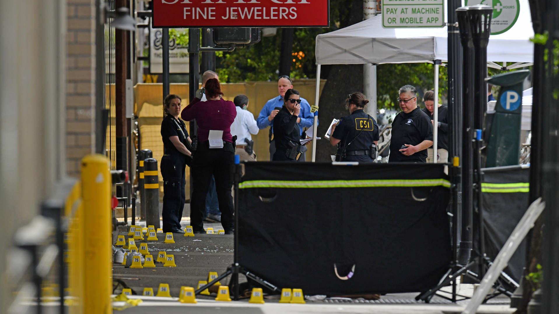 Sacramento, CA, police investigate the scene of a mass shooting Sunday. Six people were killed, and 12 others were injured.