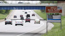 A Thin Blue Line flag hangs below the sign honoring fallen Cleveland Police Officer David Fahey, who was killed in the line of duty along this stretch of Interstate 90 in 2017. A Thin Blue Line flag hangs below the sign honoring fallen Cleveland Police Officer David Fahey, who was killed in the line of duty along this stretch of Interstate 90 in 2017.