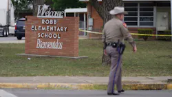 An officer walks outside of Robb Elementary School in Uvalde, TX, on Tuesday after an 18-year-old gunman killed 19 children and two adults at the school in the nation's deadliest school shooting in years. An officer walks outside of Robb Elementary School in Uvalde, TX, on Tuesday after an 18-year-old gunman killed 19 children and two adults at the school in the nation's deadliest school shooting in years.