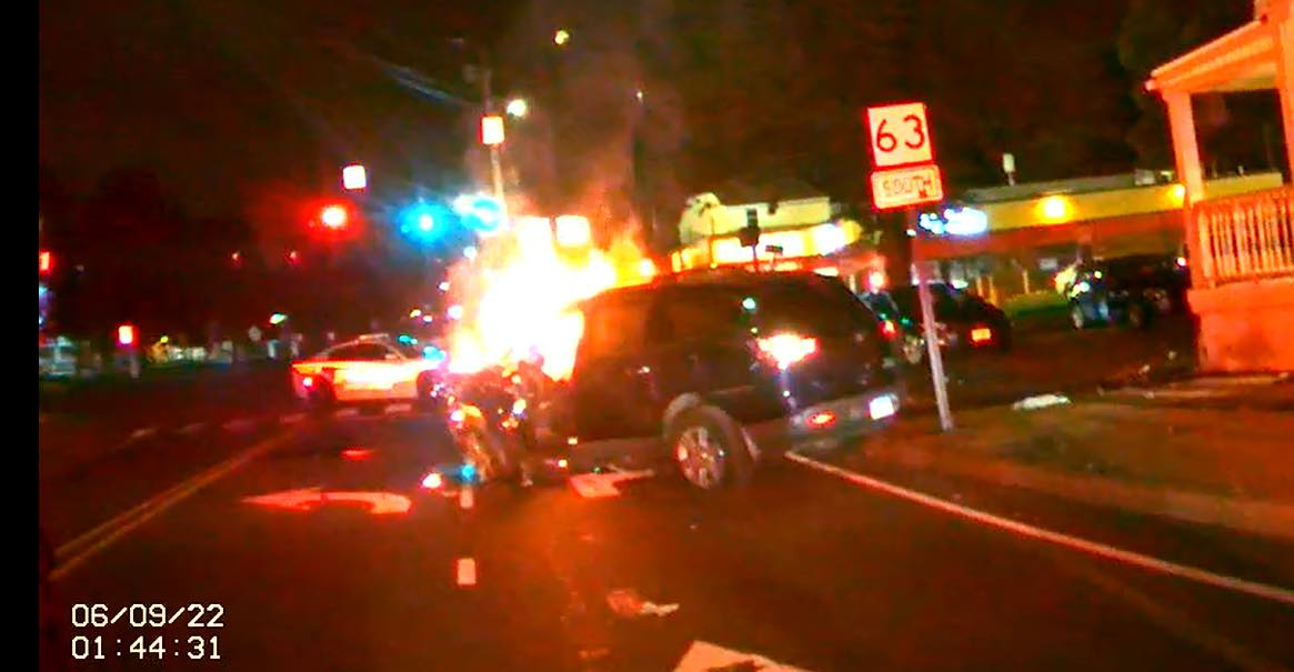 A Woodbridge, CT, police officer pulled a seriously injured driver from his car moments before it burst into flames following a crash early Thursday.