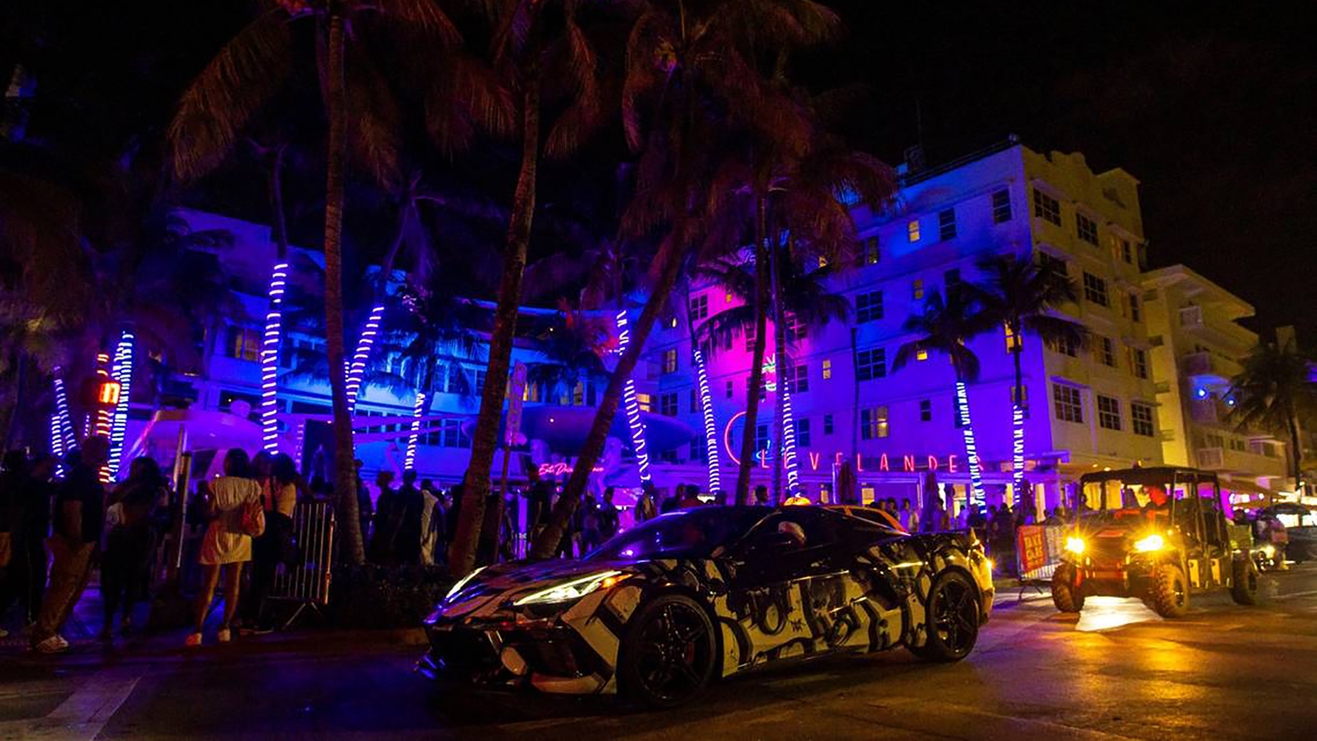 Cars and people make their way up and down Ocean Drive during the first day of Memorial Day Weekend on May 27, 2022, in Miami Beach, Florida.