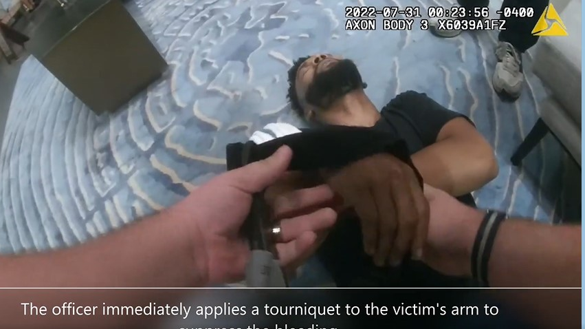 Body camera footage captured Atlanta police officers quickly applying tourniquets to a possible road rage victim who was shot in the shoulder July 31.