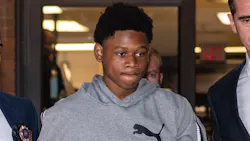 Oshawn Logan, 18, is escorted from the NYPD's 43rd Precinct stationhouse in the Bronx on Friday. He's accused of taking part in the violent mugging of an off-duty NYPD officer. Oshawn Logan, 18, is escorted from the NYPD's 43rd Precinct stationhouse in the Bronx on Friday. He's accused of taking part in the violent mugging of an off-duty NYPD officer.