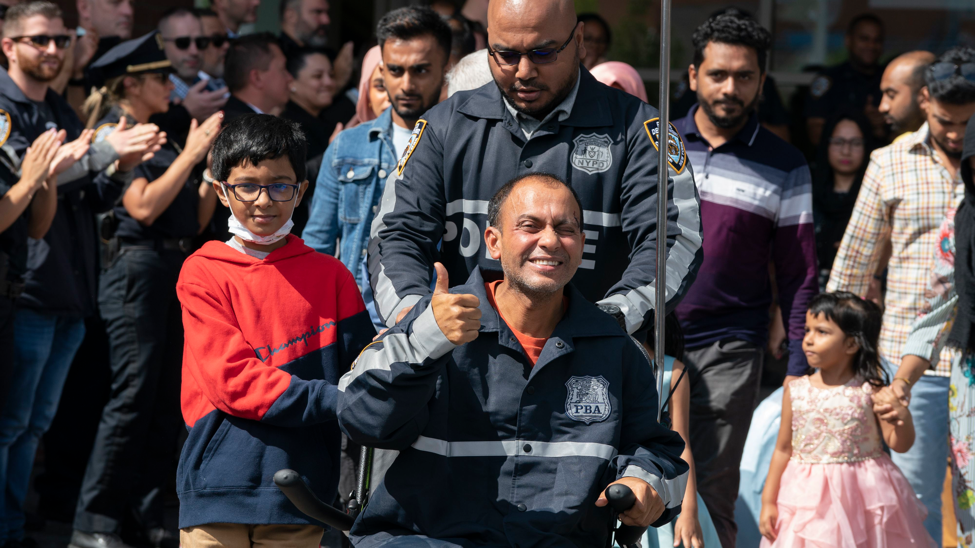 NYPD Officer Muhammed Chowdhury leaves Jacobi Medical Center with his wife and three children to the cheers and applause from fellow officers, friends and family Thursday in the Bronx.