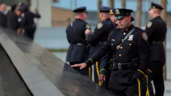 Police officers approach the south pool monument before tenth anniversary ceremonies at the site of the World Trade Center in New York City on Sept. 11, 2011. Police officers approach the south pool monument before tenth anniversary ceremonies at the site of the World Trade Center in New York City on Sept. 11, 2011.