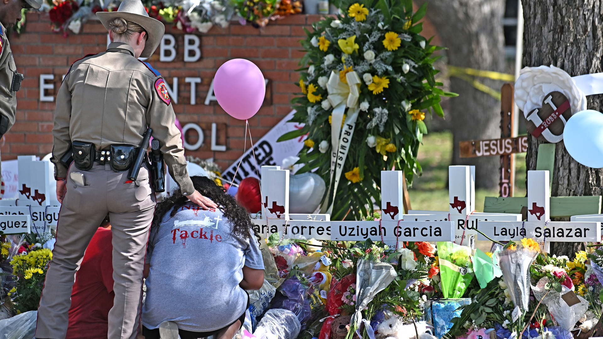 Crosses bear the names of the victims of the Robb Elementary School shooting in Uvalde.