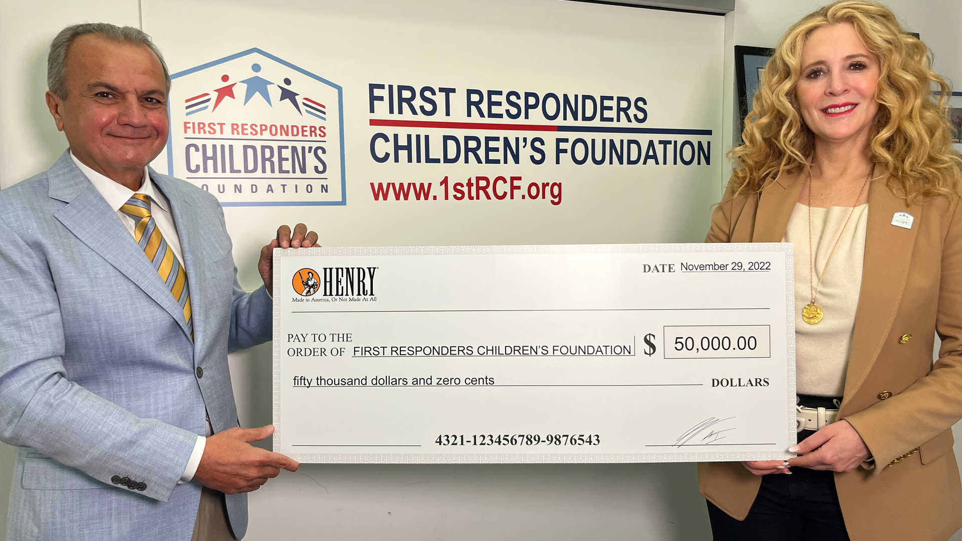Henry Repeating Arms CEO & Founder Anthony Imperato (L) presenting a $50,000 donation to First Responders Children&rsquo;s Foundation President & CEO Jillian Crane (R) at the organization&rsquo;s headquarters in New York City.