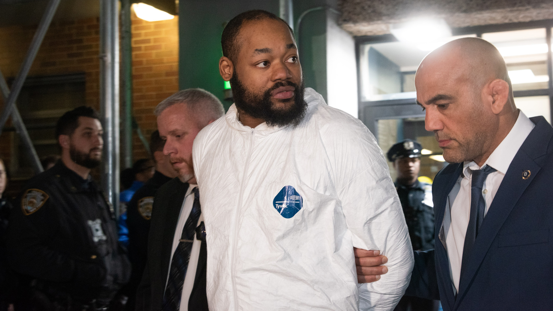 Randy 'Popper' Jones is led from the NYPD's 75th Precinct station in Brooklyn on Tuesday.