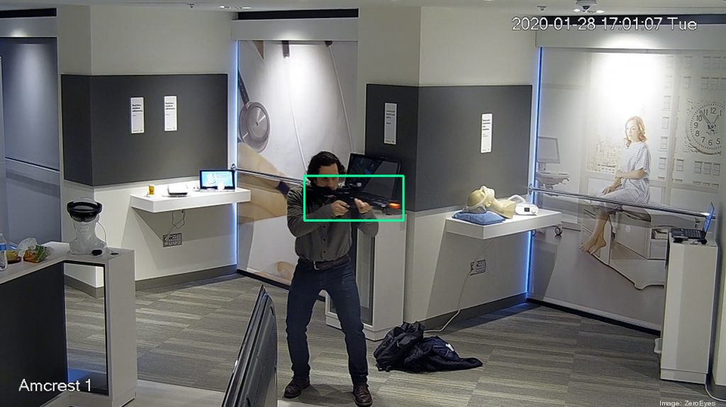 ZeroEyes' gun-detection software for surveillance cameras is demonstrated in a trial run with a replica gun.