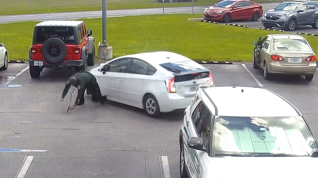 A Lee County, FL, sheriff's deputy was run down in the parking lot of the agency's headquarters Monday when a woman intentionally put her car in reverse and accelerated before driving off.