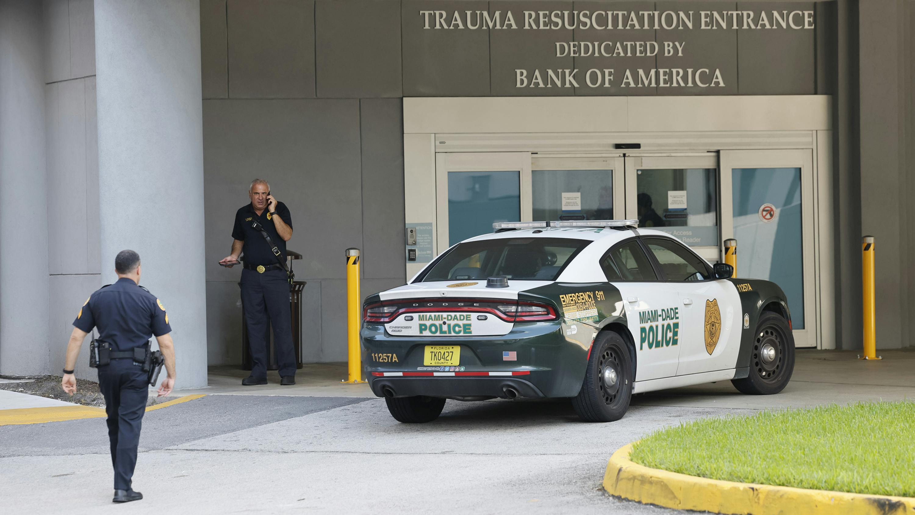 Police officers arrive at Ryder Trauma Center at Jackson Memorial Hospital after two Miami police officers were shot while responding to a call on a shooting on Thursday morning, Oct. 9, 2025, in Allapattah, Florida.