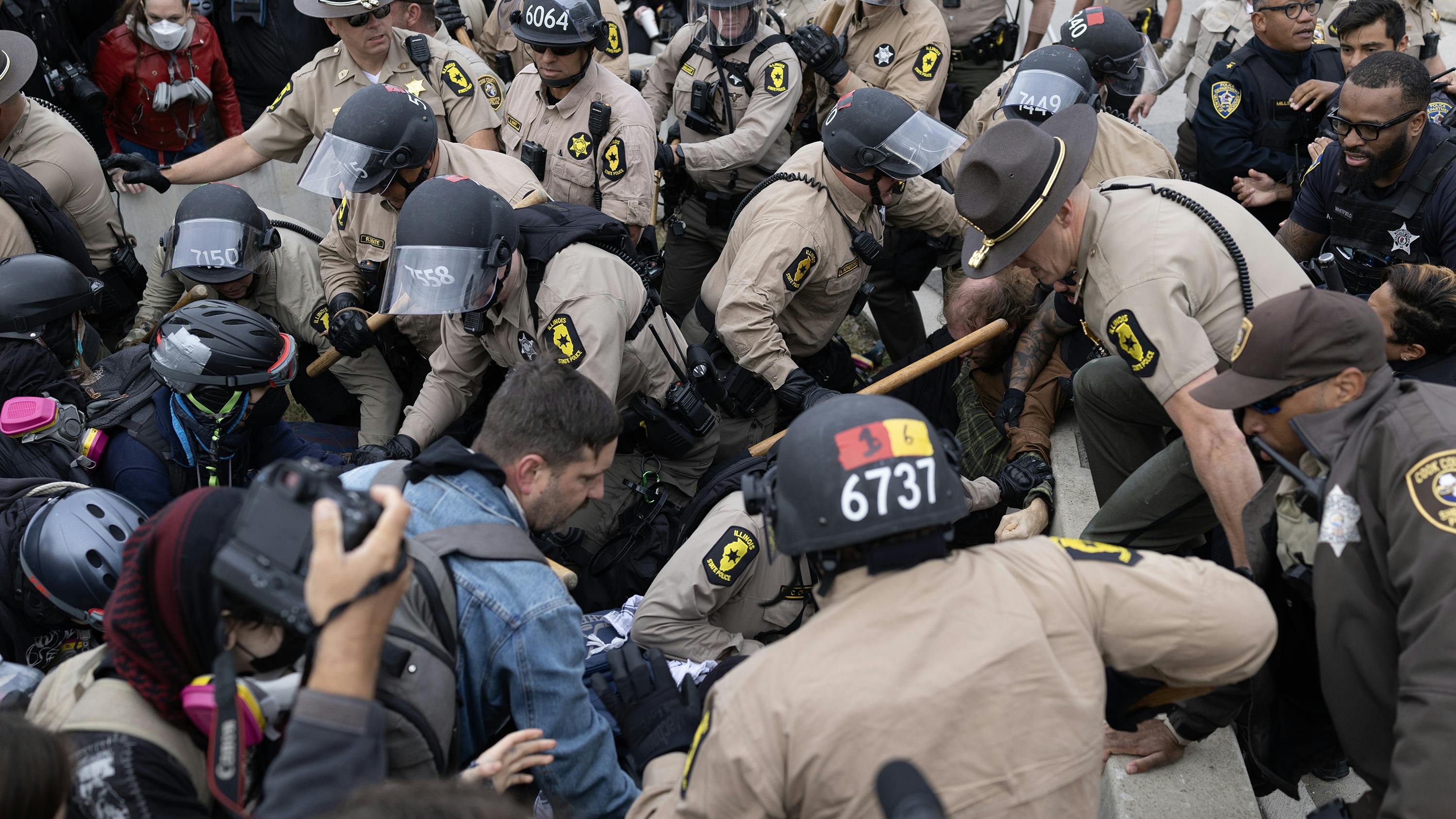 Illinois State Police troopers and Cook County sheriff's deputies control protesters at U.S. Immigration and Customs Enforcement facility in Broadview, Illinois, Oct. 10, 2025.