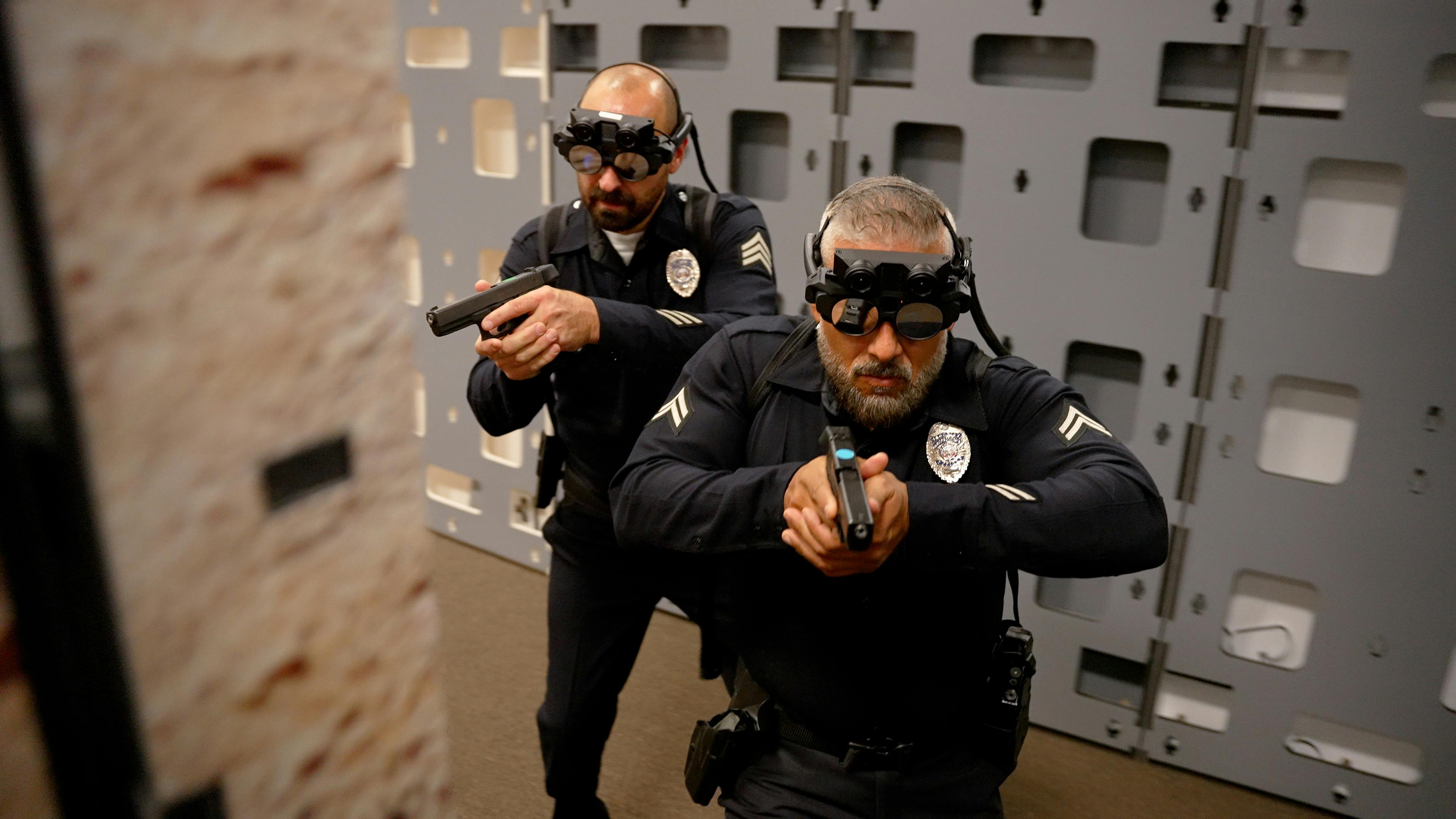 Officers are seen using the fats AR - Augmented Reality Weapons Training system.