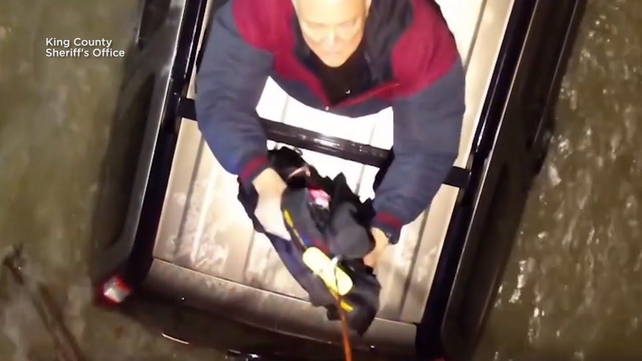 A King County, WA, Sheriff's Office drone drops a life jacket to a stranded driver.