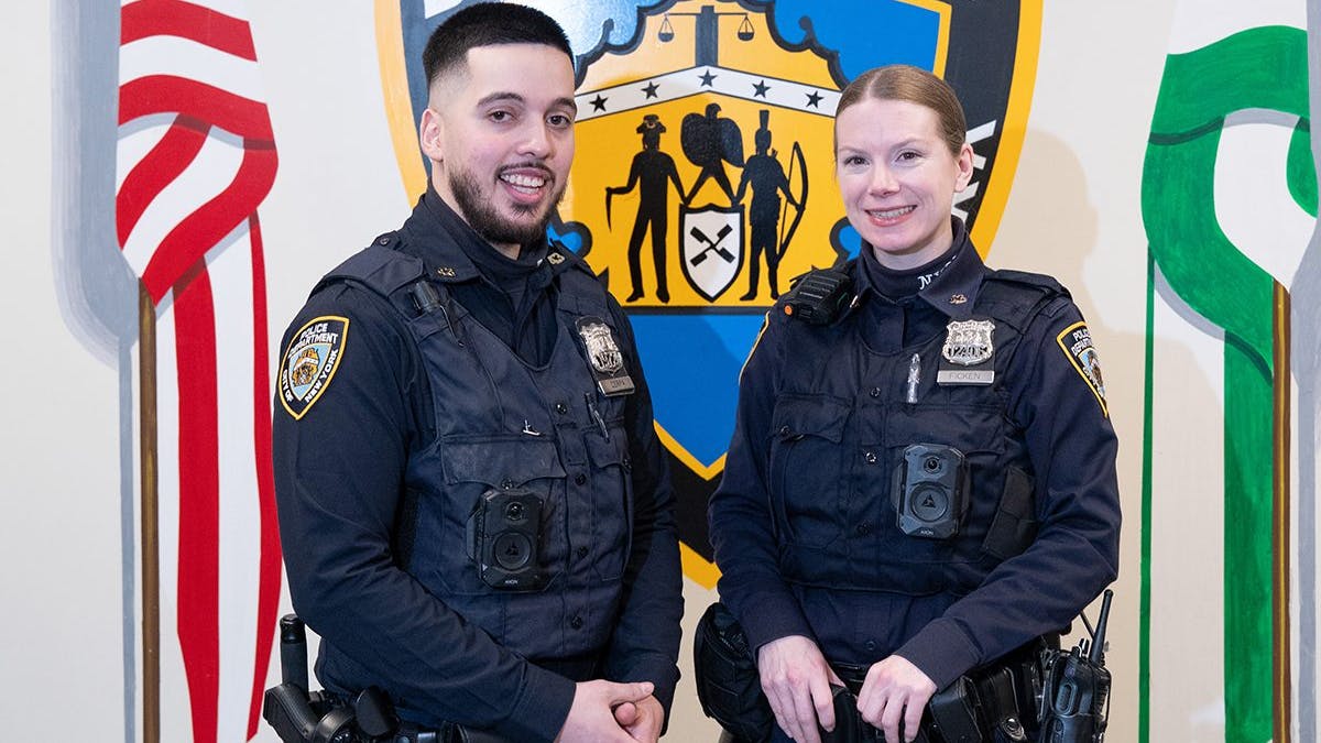 NYPD Officer Freddy Cerpa and Officer Megan Ficken are pictured at the 43rd Precinct stationhouse in the Bronx on Thursday, January 29, 2026.