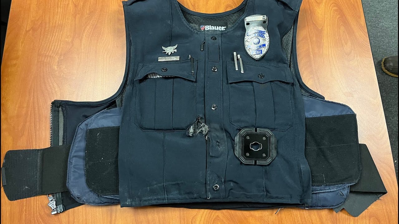 A Fall River, MA, police officer wearing a bullet-resistant vent was shot in the abdomen.