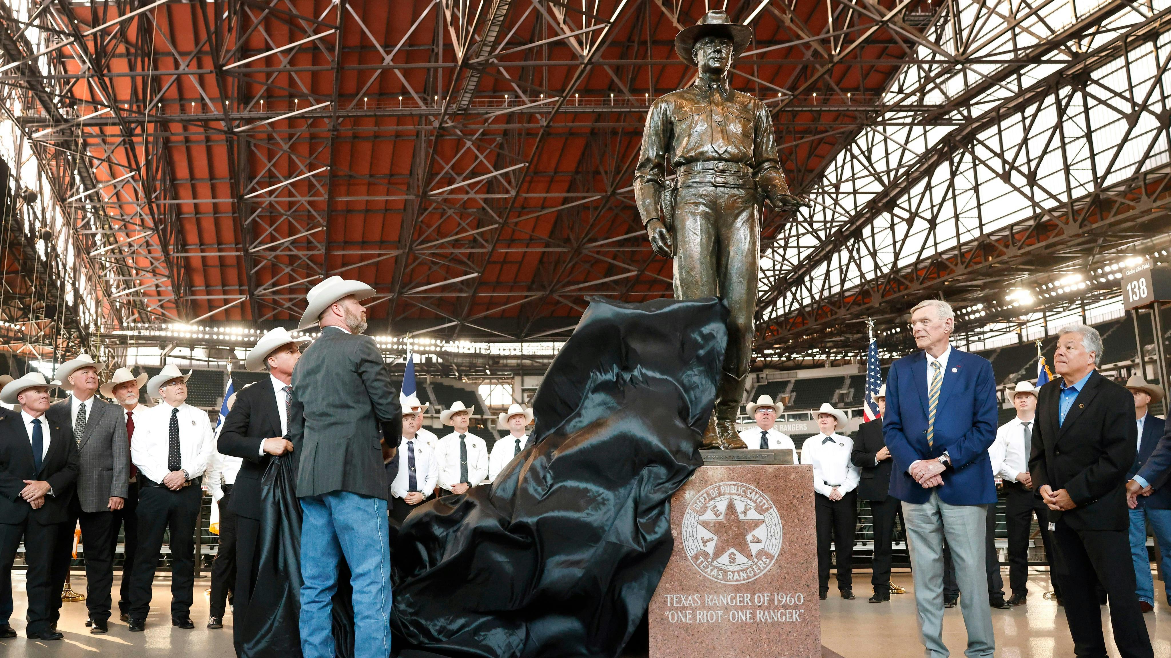 Unveiling the 'One Riot, One Ranger' statue at Globe Life Field.