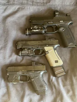Top to bottom: FN 509MRD-LE, Glock 48, Glock 43. Handgun + light + optic. Top to bottom: FN 509MRD-LE, Glock 48, Glock 43. Handgun + light + optic.