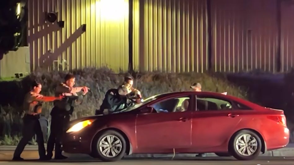 San Diego County sheriff's deputies confront armed passenger.