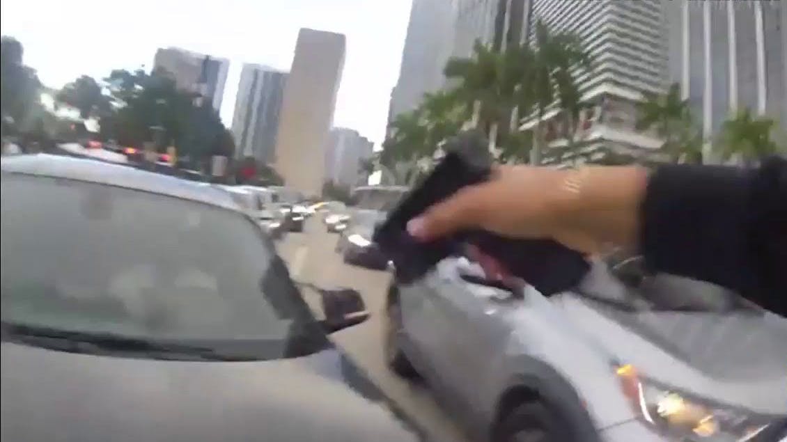 Miami police officer shoots driver who struck him.