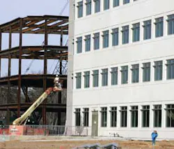 Contractors work on a new office building being constructed in the National Business Park in Columbia, Md., Wednesday, March 30, 2005. Business is booming for buildings designed to keep secrets. Structures with 8-inch-thick concrete walls, elaborate alarm Contractors work on a new office building being constructed in the National Business Park in Columbia, Md., Wednesday, March 30, 2005. Business is booming for buildings designed to keep secrets. Structures with 8-inch-thick concrete walls, elaborate alarm