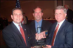 Chief Dekmar (left) and Chief Cotton (center) accept the award from SIAC law enforcement liaison Glen Mowrey. Chief Dekmar (left) and Chief Cotton (center) accept the award from SIAC law enforcement liaison Glen Mowrey.