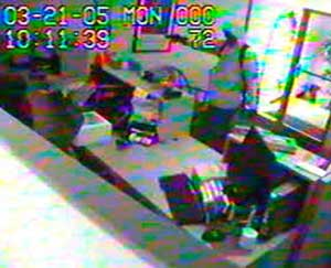 According to the FBI, this image from surveillance video, released Tuesday, Oct. 25, 2005, shows one of two suspects holding a gun during the robbery of the WestStar Bank in Vail, Colo., March 21, 2005.