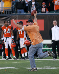 The Bengals are reexamining what it takes to secure a stadium after a fan ran onto the field of a NFL game and snatched the ball from Packer's quarterback Brett Favre.
