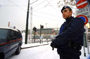 An Italian Carabinieri paramilitary police officer stands guard in front of Turin's Olympic stadium, one of the venues where the Feb. 10-26 2006 Winter Olympic games will be held, Friday, Jan. 27, 2006. During a briefing Italian Interior Ministry official