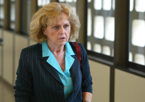 Plaintiff Janet Orlando leaves a Fresno Superior Court courtroom during a break in closing arguments in her sexual harassment case against home security company Alarm One Inc. on Wednesday, April 25, 2006, in Fresno, Calif. Lawyers for Orlando who was spa