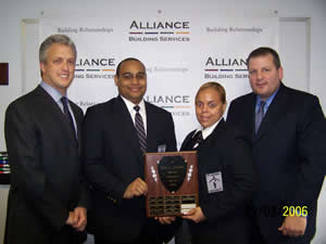 Gary Green, CEO, Alliance Building Services; Amable Arias, honoree; Dayanara Martinez, honoree; David A. Reiss, senior vice president, Classic Security.