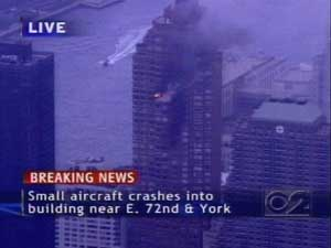 This image from television shows fire and smoke after a small plane crashed into a high-rise on Manhattan's Upper East Side, police said Wednesday Oct. 11, 2006.