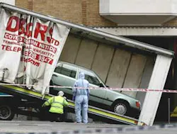 A Mercedes is loaded onto a truck in Haymarket Street, near Piccadilly, central London on Friday, June 29, 2007. The Mercedes was said to contain a car bomb. A Mercedes is loaded onto a truck in Haymarket Street, near Piccadilly, central London on Friday, June 29, 2007. The Mercedes was said to contain a car bomb.
