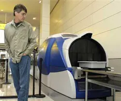 A passenger watches as his carry-on baggage goes through the newly unveiled Analogic Cobra automatic explosive detection system at Baltimore/Washington International Thurgood Marshall Airport (BWI )on Wednesday, Oct. 24, 2007. BWI is one of the first few A passenger watches as his carry-on baggage goes through the newly unveiled Analogic Cobra automatic explosive detection system at Baltimore/Washington International Thurgood Marshall Airport (BWI )on Wednesday, Oct. 24, 2007. BWI is one of the first few