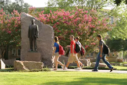 Students traverse the concourse at Texas A&M University Students traverse the concourse at Texas A&M University