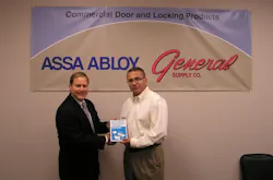 John Simon (r), CEO of General Supply, receives “official” ASSA ABLOY Authorized Channel Partner status from Lester LaPierre, director of business development for electronic access control for ASSA ABLOY Door Security Solutions. John Simon (r), CEO of General Supply, receives “official” ASSA ABLOY Authorized Channel Partner status from Lester LaPierre, director of business development for electronic access control for ASSA ABLOY Door Security Solutions.