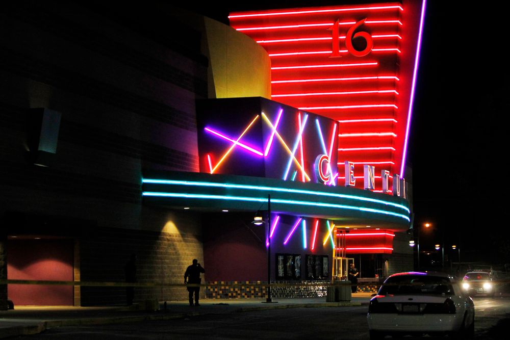 Police are pictured outside of a Century 16 movie theatre where as many as 14 people were killed and many injured at a shooting during the showing of a movie at the in Aurora, Colo., Friday, July 20, 2012. (AP Photo/Ed Andrieski)