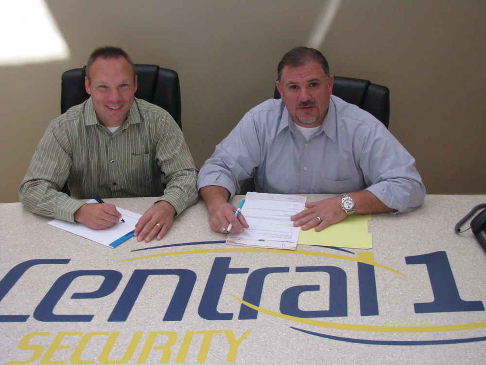 Chris Tolliver, operations manager, and Chris Utter, a partner in Central 1 Security, embrace the future with new ways of securing RMR for the Wisconsin-based company.