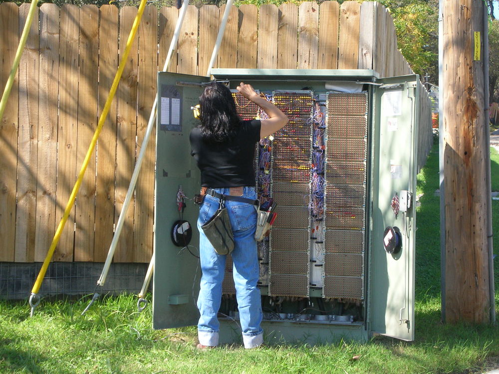 Should telecom technicians be allowed to install security systems without additional licensing?