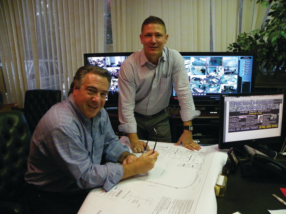 Ken Mara, President & CEO, and Joseph Cestra, Technical Services Director, review Vanderbilt plans.