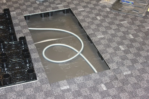 This photo, taken during a recent installation, shows how cables are managed underneath the PowerFlor.